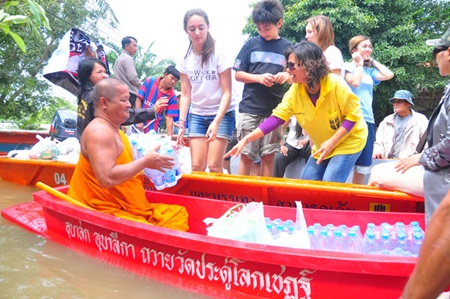 Regent’s students and parents provide aid to the local temple to distribute.