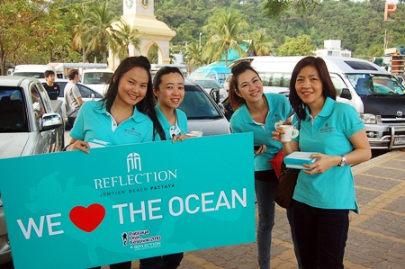 Staff from sponsor Reflection Condo enjoy breakfast while prepping signs for the Festival’s “Save the Ocean” theme.