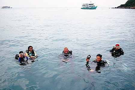 Aquanauts Dive Centre instructor Gary Gwilliam, center, waits with his charges to begin the underwater treasure hunt. 