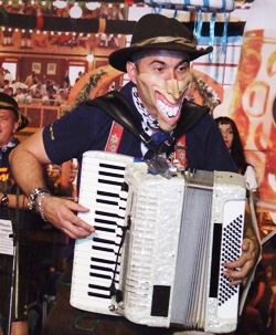 “Smiley” rips through the chords on his accordion.