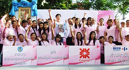 Some of the walkers gather on stage to begin the World Pink Charity Walk to raise funds to support patients with breast cancer at Her Majesty Queen Sirikit’s Center.