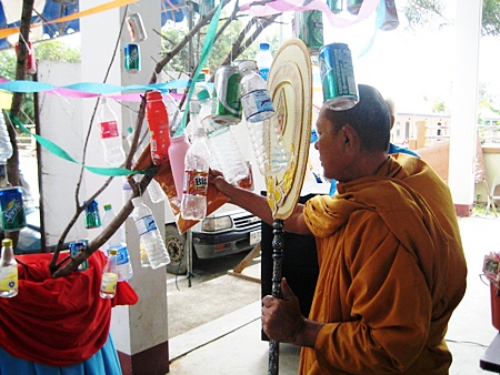 A monk leads the ‘tod pha pa’ recycling merit making ceremony at Wat Raj Samakee in Sattahip.
