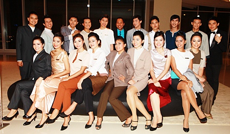 Team members representing each department pose for a photo before their fashion show.