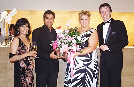 Sue Kukarja, director of Pattaya Mail Television, and Tony Malhotra, director of Pattaya Mail Media Group, congratulate Peta Ruiter, director of business development, and Michel Sheffers, director of operations.