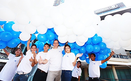 2010 blue and white balloons are released into the sky.