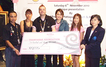 (L to R) Roland Nicholich, assistant general manager of Hard Rock Cafe Phuket; Panta Cheidech. director of sales and marketing for Hard Rock Cafe Phuket; Matthew Carlos, manager of the Hard Rock Cafe Pattaya; Sita Vonkhoporn, PR & marketing for Hard Rock Cafe Bangkok; Nualprang Varongkriengkrai, sales & marketing for Hard Rock Cafe Bangkok; and Manussawad Kesboonchu, manager of the Thanyarak Breast Cancer Foundation display the funds raised during the charity drive.