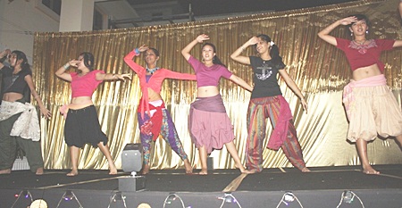 A group of secondary students keep the show going with their Indian modern dance.