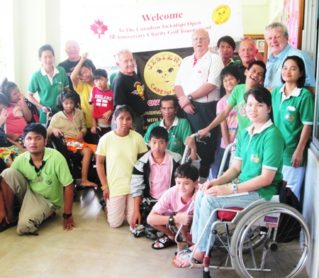 Erle Kershaw, Bernie Tuppin, Wayne Ogonoski, Bill Freeman, Father Giovanni and Khun Kannika (in wheelchair) with the kids.