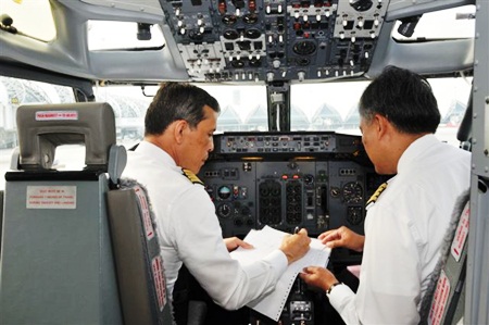His Royal Highness Crown Prince Maha Vajiralongkorn goes through pre-flight preparations before takeoff.