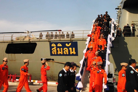 Officers and crew members disembark HTMS Similan at Juksamet port following a four month mission at sea to protect Thai merchant vessels against piracy.