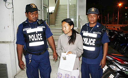 Police put Sasithorn on display for the media. 