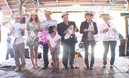Dignitaries take to the stage to announce the distribution of free condoms to Valentine shoppers at the Pattaya Floating Market.