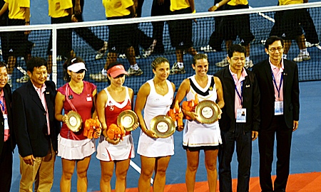The doubles champions and runners-up pose with their trophies.