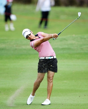 Tseng strikes an iron into the green during her final round.