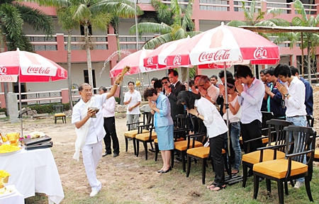 A Brahman priest performs a blessing ritual during ceremonies for the laying of the structural foundations for one of the buildings in the Dusit Thani College compound, Pattaya campus. The ceremony was attended by Dusit International executives led by Vipada Donavanik (right, foreground), Veera Patpathanapanich (centre), rector of Dusit Thani College and Dusit Thani Pattaya management led by Thidsida Shingrissiri and Teerasak Chuenchob. The newest campus of Thailand’s leading hospitality school is scheduled to open in June this year.