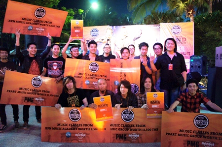 Luminasion pose with musicians from the second and third placed bands after winning first prize at the Battle of the Bands 2011 contest held at the Hard Rock Hotel Pattaya on Friday,. March 11. 