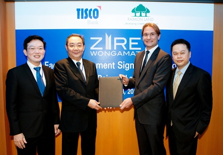 Raimon Land Chief Executive Officer Hubert Viriot and TISCO Bank Plc. President Suthas Ruangmanamongkol sign the THB 1,027 million project financing agreement for Zire Wongamat. Also shown in the photo are Kitti Tangsriwong (far right), COO Raimon Land and Sakchai Peechapat (far left), Senior Executive Vice President, TISCO Bank Plc.