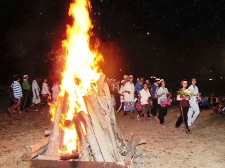 Students circle the campfire during their scouting camp at Sattahip’s Prince Chumphon Military Camp. 