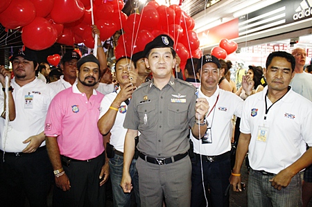 Pattaya Tourist Police commander Maj. Col. Arun Prompan (center) during the Valentine’s Day red balloon giveaway on Walking Street.