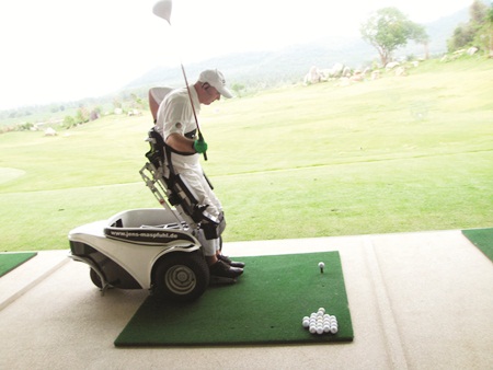 Jens Maspfuhl demonstrates his new Power-Golfer wheelchair.