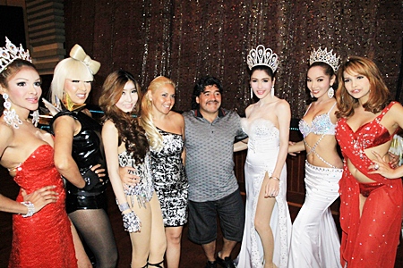 Argentinean football legend Diego Armando Maradona (center right) and his girlfriend Veronica Ojeda (center left) meet some of the stars of the Alcazar cabaret show on Friday, March 4.