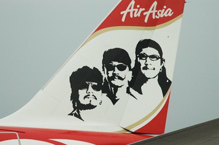 The plane’s tail carries the picture of Thierry, Lek and Add Carabao.