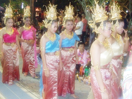 Beautiful goddesses follow the head deity in a procession around the festival grounds to inspect the food on offer.