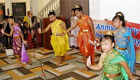 Toy’s “Angels”, otherwise known as the delightful children from Pattaya Orphanage, perform a traditional Thai dance to help PCEC members celebrate its ten years.