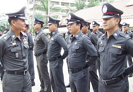 Lt. Gen. Wibun Bangthamai (left) inspects the force at the Chonburi Immigration office in Jomtien. 