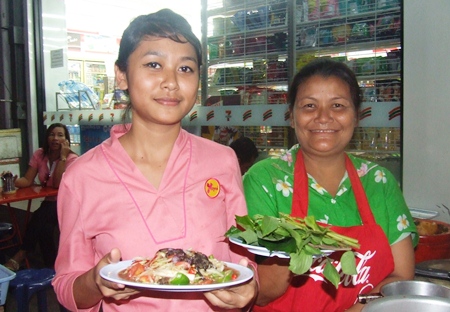 It’s ready to serve: Sompong Prachariko and her daughter Sukalyani Prachariko prepare to serve mom’s signature dish, “Larb Ped Buriram,” or Buriram Spicy Minced Duck Salad. 