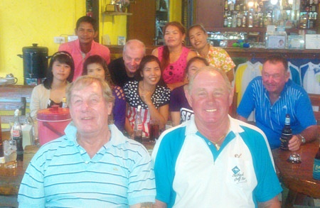 Barry Chadbourn & Capt’ Bob relax after their win in the Songkran scramble on Tuesday.  In the background are some of the caddies with Sel Wegner and Geoff Moodie.