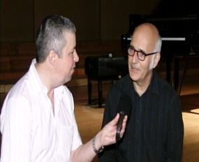Ludovico Einaudi, right, talks to Paul Strachan during an interview for Pattaya Mail Television.