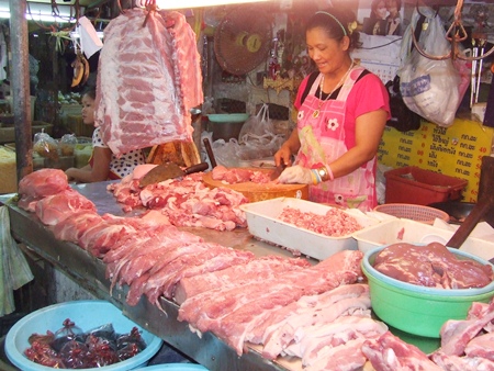 Saibua Hatyoung, a pork vendor at South Pattaya’s Wat Chaimongkol Market, says prices are higher than she’s seen in a decade and, as a result, her business is off 50 percent. 