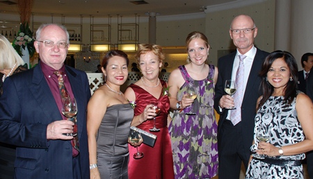 (L to R) Geoffrey Robinson; Suphaporn Robinson; Anja Schoof & daughter; Hans Schoof; and Chitra Chandrasiri are all smiles during the anniversary event.