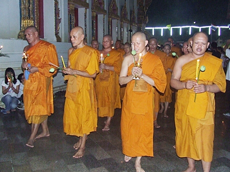 Monks lead the Wien Thien ceremony around Wat Chaimongkol last Tuesday for Visakha Bucha Day.  Visakha Bucha Day is one of the three holiest days on the Buddhist calendar and this year was designated by UNESCO as “World Peace Day.”  