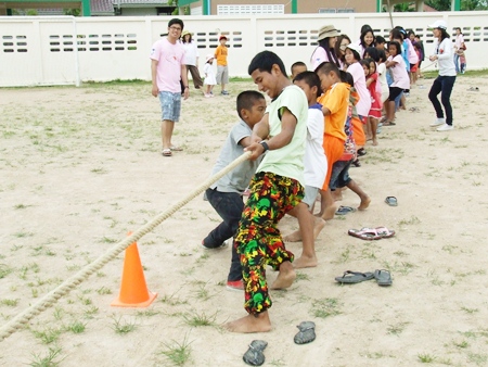 The youngsters learn teamwork during the tug-o-war event.