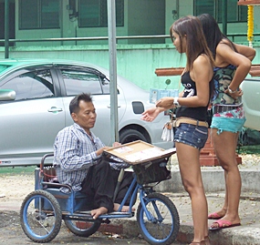 Mongkol Buakiew survives by selling lottery tickets in Pattaya. 