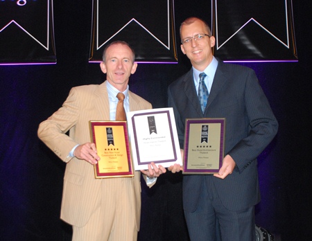 Stuart Shield, left, Chairman of the International Hotel Awards and Harald Feurstein,  right, General Manager of Hilton Pattaya, hold up the awards presented to the hotel at the Asia Pacific Hotel Awards 2011 ceremony at the Longemont Hotel, Shanghai, May 31.