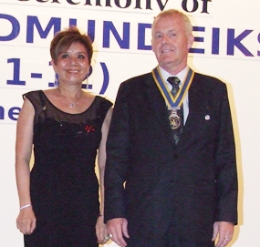 President Gudmund Eiksund stands proudly with his first lady Linda.