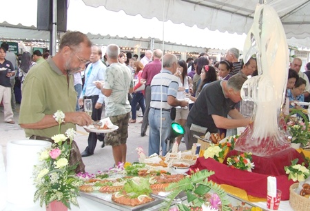 Guests milled about tasting fine foods and wines imported from all corners of the world