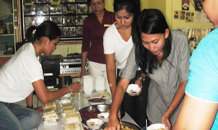 Guests from the Sheraton Pattaya Resort prepare snacks for the youngsters.