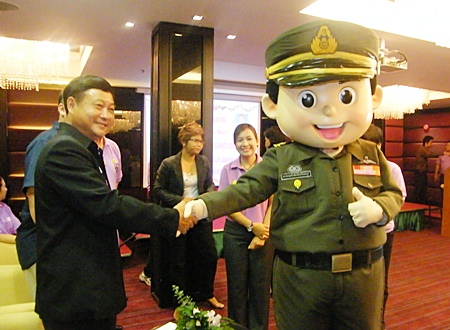 Chonburi Immigration’s “Yim Yim” (smile) mascot is introduced at the opening ceremony for Immigration’s new service minded campaign. 