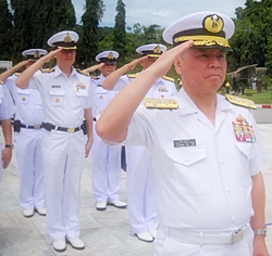 After laying a wreath to pay respect to Thai marines who died during service, Adm. Masahiko Sugimoto salutes active-duty personnel for their support after the March 11 earthquake. 