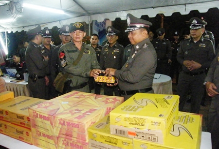 Royal Thai Police Commander-in-Chief Gen. Wichian Potphosri presents energy drinks to officers on duty. 