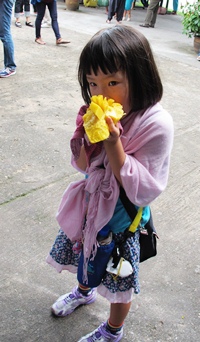 This little one enjoys fresh sweet mango.