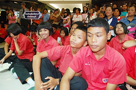Hundreds of supporters cheer on their teams.