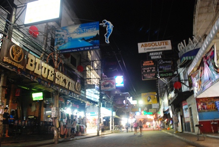 The bars are closed and the streets are dark, but a few people wander out to see a closed down Walking Street during the elections.