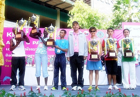Road race winners receive their trophies from Pattaya Mayor Itthiphol Kunplome.