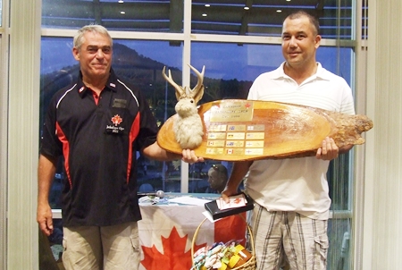 2011 Canadian Jackalope Champion Paul Daud (right) is handed the perpetual trophy by Dale Drader. 