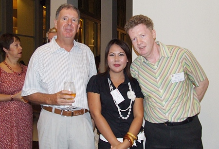 Call me irresistible, Chutima Thambun (Admin Assistant Pattaya Mail) is flanked by Dr. Alastair Acken and Raymond O’Reilly. (Lecturer, Asian University).